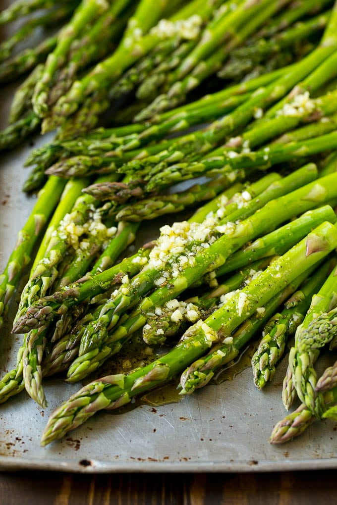 Roasted Asparagus Recipe | Baked Asparagus | Asparagus Side Dish #asparagus #garlic #sidedish #keto #lowcarb #dinner #sadud Raw spears drizzled with olive oil, garlic, herbs, salt and pepper.