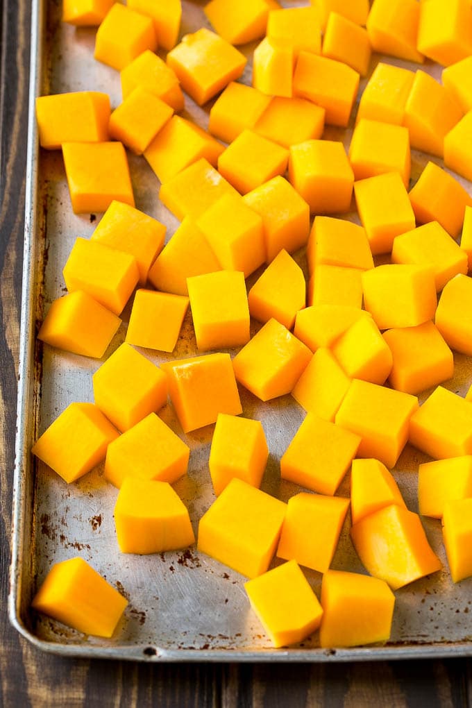 Roasted Butternut Squash Recipe | Baked Butternut Squash | Butternut Squash Side Dish #butternutsquash #squash #fall #vegetarian #dinner #sadud Raw cubed squash on a sheet pan.