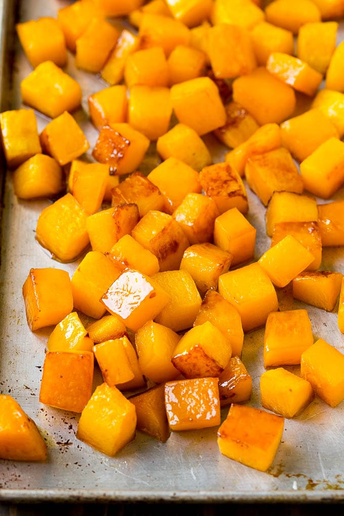 Roasted Butternut Squash Recipe | Baked Butternut Squash | Butternut Squash Side Dish #butternutsquash #squash #fall #vegetarian #dinner #sadud Caramelized cooked butternut squash on a sheet pan.