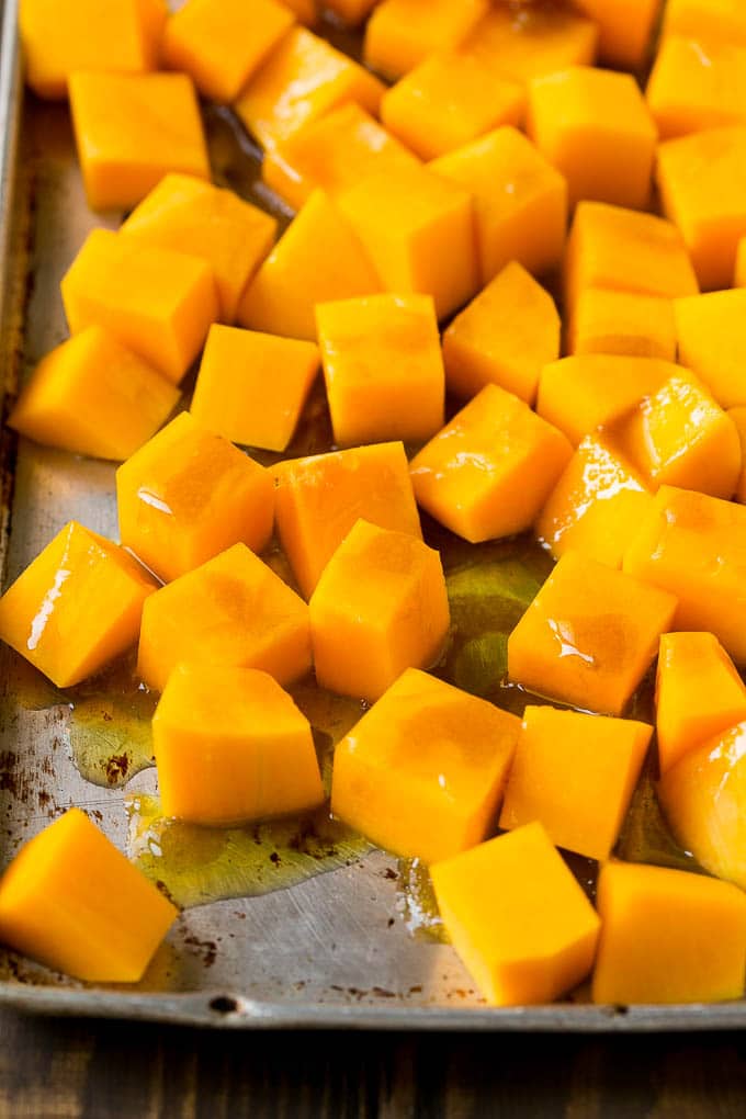 Roasted Butternut Squash Recipe | Baked Butternut Squash | Butternut Squash Side Dish #butternutsquash #squash #fall #vegetarian #dinner #sadud Cubes of winter squash coated in olive oil, brown sugar and maple syrup.