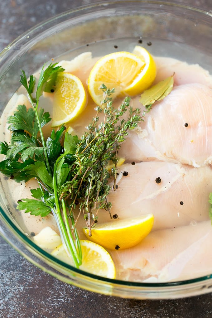 Smoked Chicken Breast Recipe | BBQ Chicken | Smoked Chicken #bbq #chicken #smoker #dinner #glutenfree #sadud Chicken breasts in a bowl of brine with lemon and herbs.