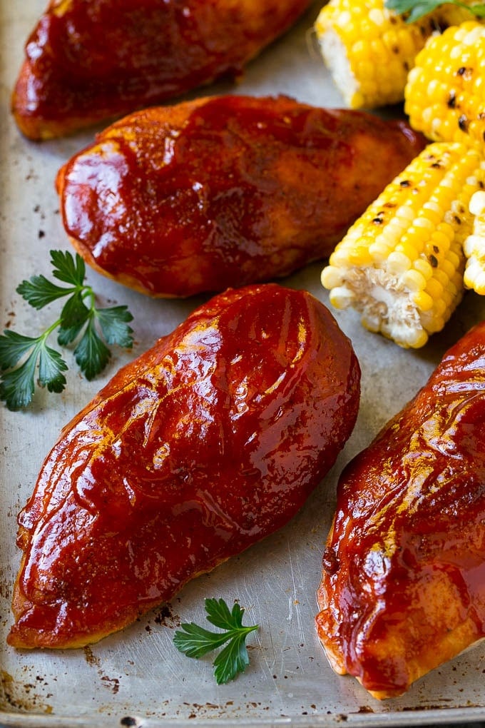 Smoked Chicken Breast Recipe | BBQ Chicken | Smoked Chicken #bbq #chicken #smoker #dinner #glutenfree #sadud Smoked chicken breasts on a sheet pan with corn on the corn and fresh herbs.