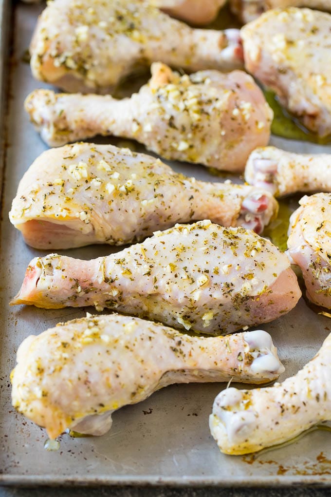 Baked Chicken Drumsticks Recipe | Roasted Chicken Drumsticks | Garlic and Herb Chicken #dinner #chicken #garlic #glutenfree #lowcarb #keto #cleaneating #sadud Marinated chicken legs on a sheet pan, ready to go into the oven.