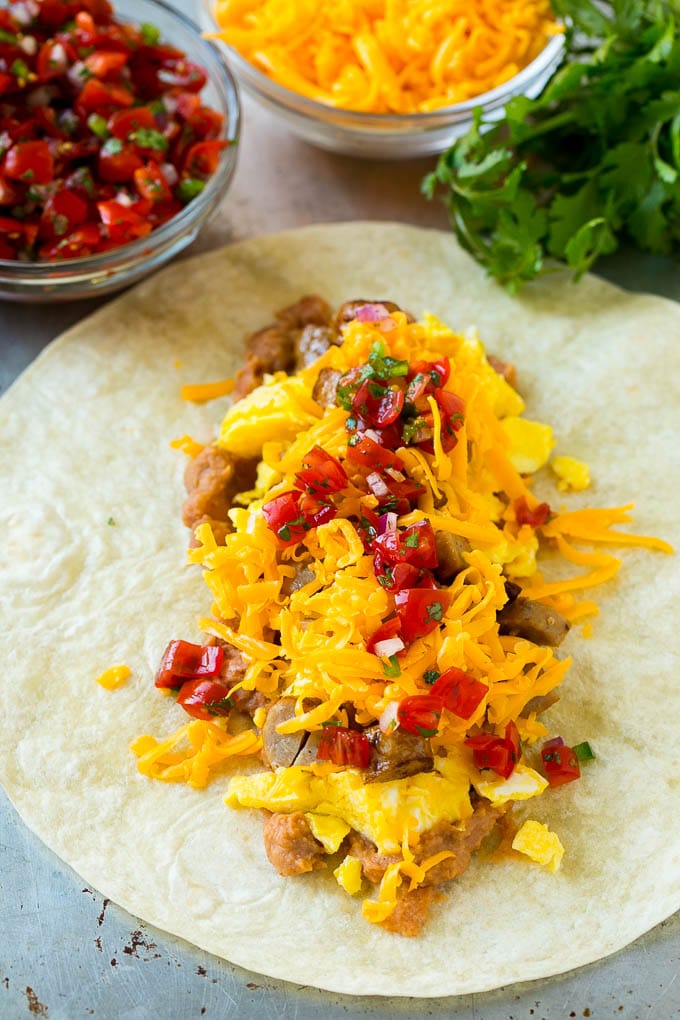 Breakfast Burrito Recipe | Sausage Breakfast Burrito #breakfast #sausage #eggs #burrito #sadud A flour tortilla topped with eggs, sausage, cheese and pico de gallo salsa.