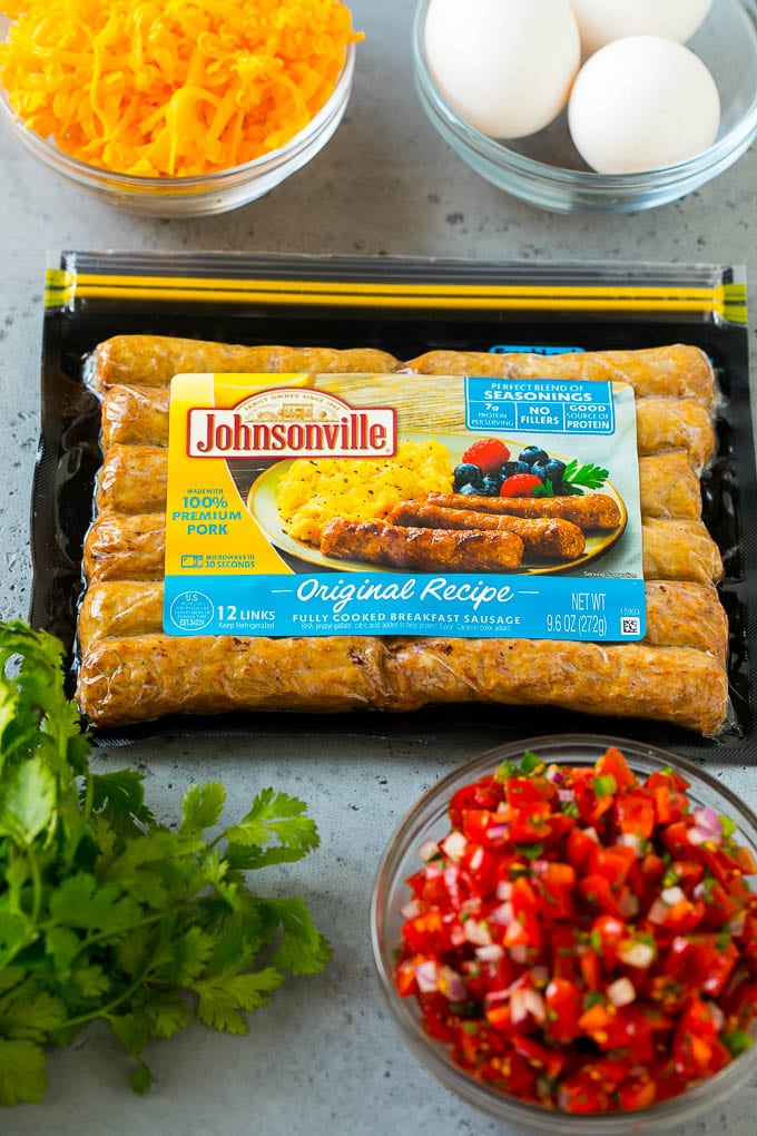 Breakfast Burrito Recipe | Sausage Breakfast Burrito #breakfast #sausage #eggs #burrito #sadud A package of sausage links along with bowls of pico de gallo, eggs and shredded cheese.