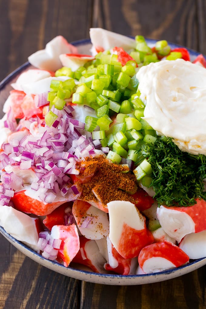 Crab Salad Recipe | Seafood Salad | Deli Salad #crab #salad #seafood #lowcarb #keto #lunch #dinner #sadud Imitation crab, seasoning, dill, celery and mayonnaise in a bowl.