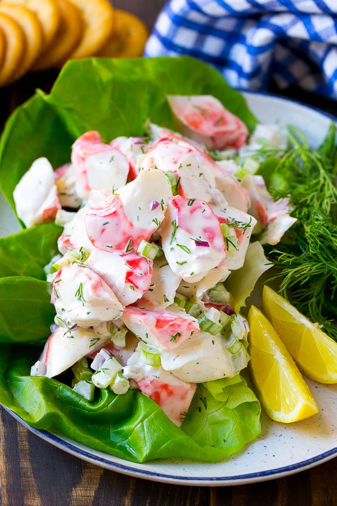Crab Salad Recipe | Seafood Salad | Deli Salad #crab #salad #seafood #lowcarb #keto #lunch #dinner #sadud Crab salad served on a bed of lettuce with a side of crackers.