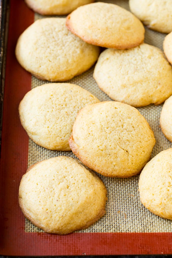Eggnog Cookies Recipe | Holiday Cookies | Christmas Cookies #cookies #eggnog #baking #christmas #sprinkles #dessert #sadud Baked eggnog cookies on a sheet pan.