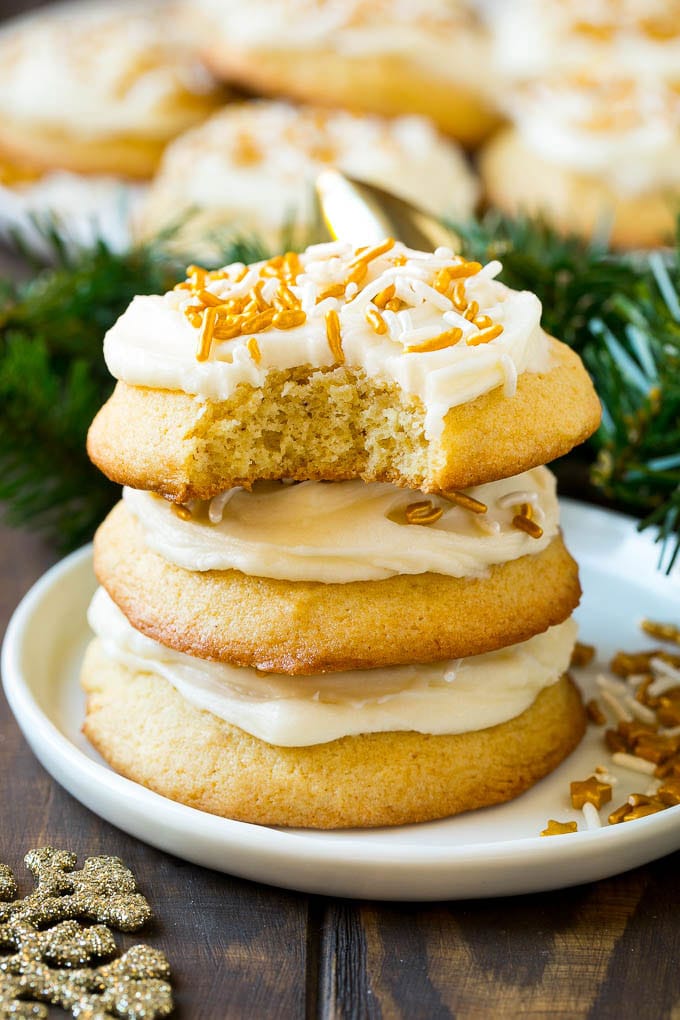 Eggnog Cookies Recipe | Holiday Cookies | Christmas Cookies #cookies #eggnog #baking #christmas #sprinkles #dessert #sadud A stack of eggnog cookies with a bite taken out of one.