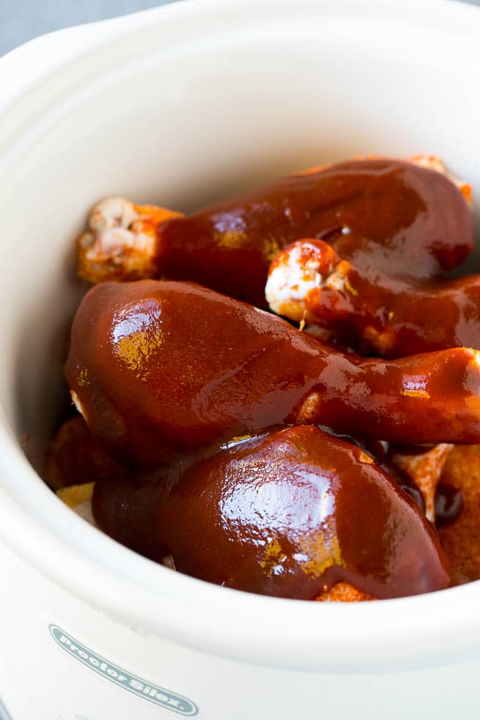 Slow Cooker Chicken Drumsticks Recipe | Crock Pot Chicken Drumsticks | BBQ Chicken Drumsticks #chicken #drumsticks #slowcooker #crockpot #bbq #dinner #sadud A crock pot of chicken drumsticks coated in BBQ sauce.