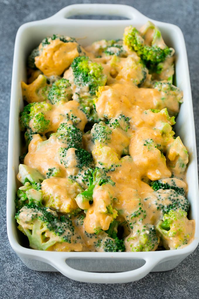 Broccoli Casserole Recipe | Broccoli and Cheese Casserole | Baked Broccoli #broccoli #cheese #casserole #sidedish #dinner #sadud Florets in a baking dish coated with cheese sauce.