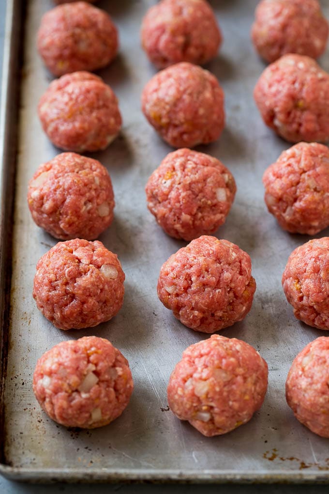 Sweet and Sour Meatballs Recipe | Slow Cooker Meatballs | Crockpot Meatballs | Cocktail Meatballs #meatballs #beef #slowcooker #crockpot #dinner #appetizer #sadud Homemade meatballs on a sheet pan.