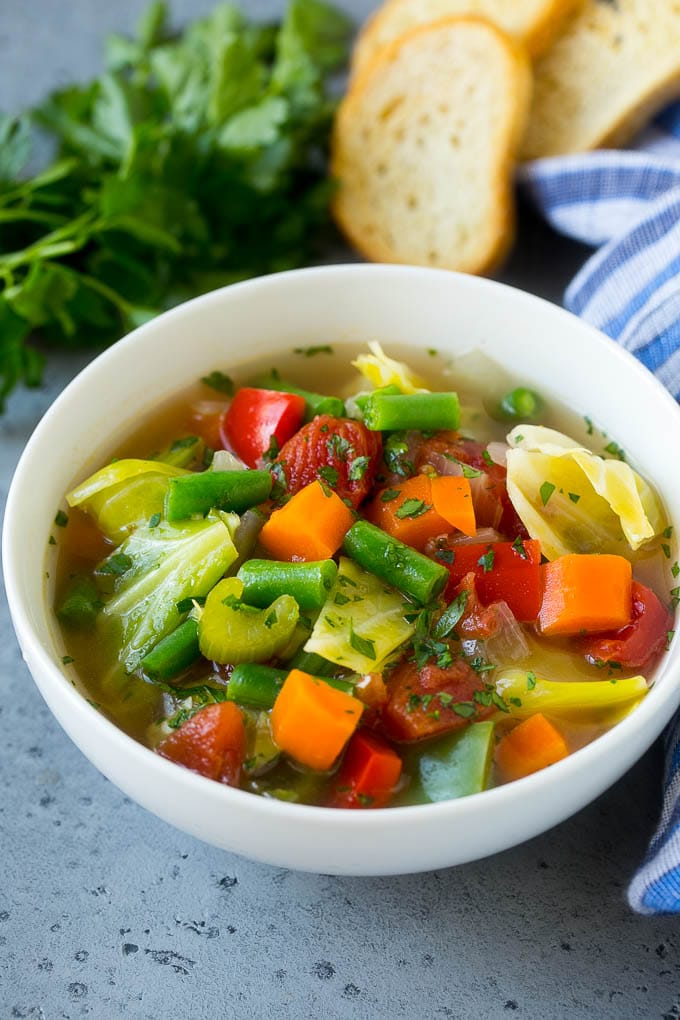 Cabbage Soup Recipe | Vegetable Soup | Veggie Soup | Healthy Soup #soup #healthy #cleaneating #cabbage #vegetables #veggies #dinner #sadud A bowl of cabbage soup with carrots, celery and tomatoes in broth.