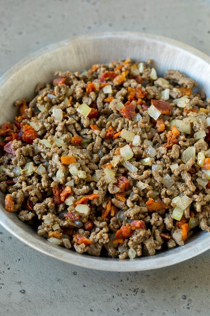 Cheeseburger Pie Recipe | Cheeseburger Casserole | Ground Beef Recipe #cheeseburger #beef #bacon #cheese #casserole #dinner #sadud Ground beef, onions and bacon in a tin.