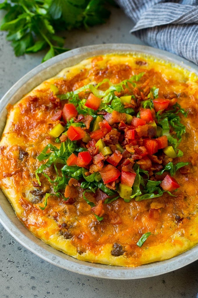 Cheeseburger Pie Recipe | Cheeseburger Casserole | Ground Beef Recipe #cheeseburger #beef #bacon #cheese #casserole #dinner #sadud Cheeseburger pie topped with bacon, lettuce, pickles and tomatoes.