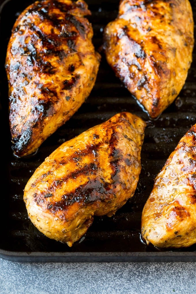 The best chicken marinade produces tender and juicy results every time! Marinated chicken breasts cooked on a grill pan.
