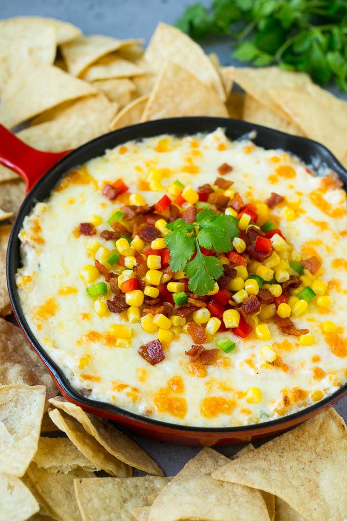 Corn Dip Recipe | Hot Cheese Dip | Bacon Dip #corn #dip #bacon #cheese #appetizer #snack #sadud Hot corn dip made with two types of cheese, corn, peppers and bacon, served with tortilla chips.