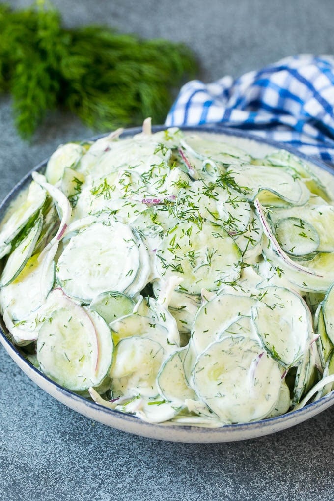 Creamy Cucumber Salad Recipe | German Cucumber Salad | Cucumber Salad #cucumber #salad #dinner #lunch #sadud #cucumbersalad A serving bowl of creamy cucumber salad topped with fresh dill.