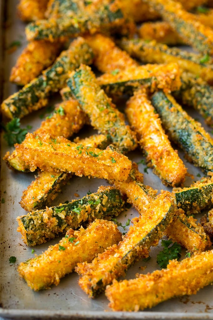 Fried Zucchini Recipe | Zucchini Fries | Zucchini Recipe #appetizer #zucchini #snack #sadud Fried zucchini sticks on a sheet pan.