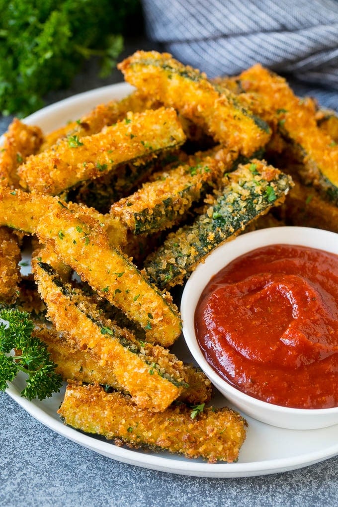 Fried Zucchini Recipe | Zucchini Fries | Zucchini Recipe #appetizer #zucchini #snack #sadud A plate of fried zucchini served with marinara for dipping.