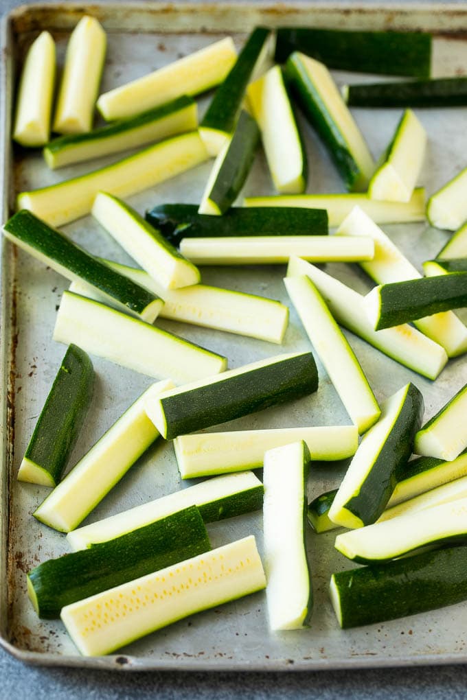 Fried Zucchini Recipe | Zucchini Fries | Zucchini Recipe #appetizer #zucchini #snack #sadud Raw sticks on a sheet pan.