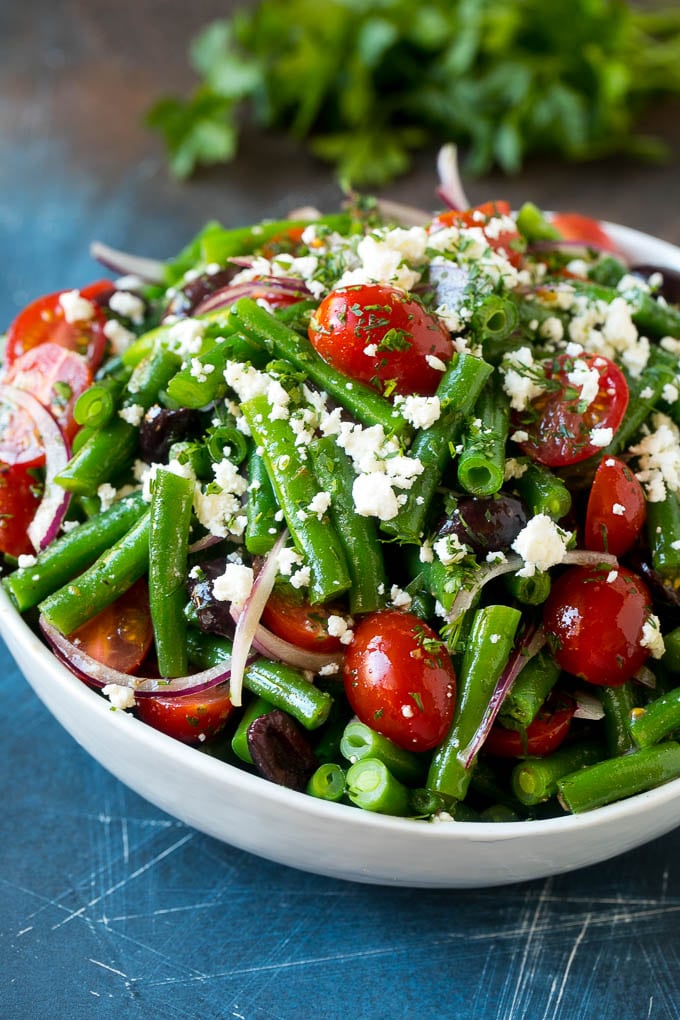 Green Bean Salad Recipe | String Bean Salad | Chopped Salad #greenbeans #tomatoes #olives #salad #cleaneating #lowcarb #glutenfree #sadud Green bean salad tossed in a vinaigrette and topped with feta cheese and herbs.