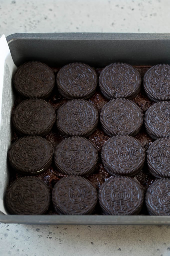 Oreo Brownies Recipe | Homemade Brownies | Chocolate Chip Brownies #brownies #oreos #chocolate #dessert #sweets #sadud A layer of brownie batter with a layer of Oreo cookies on top.