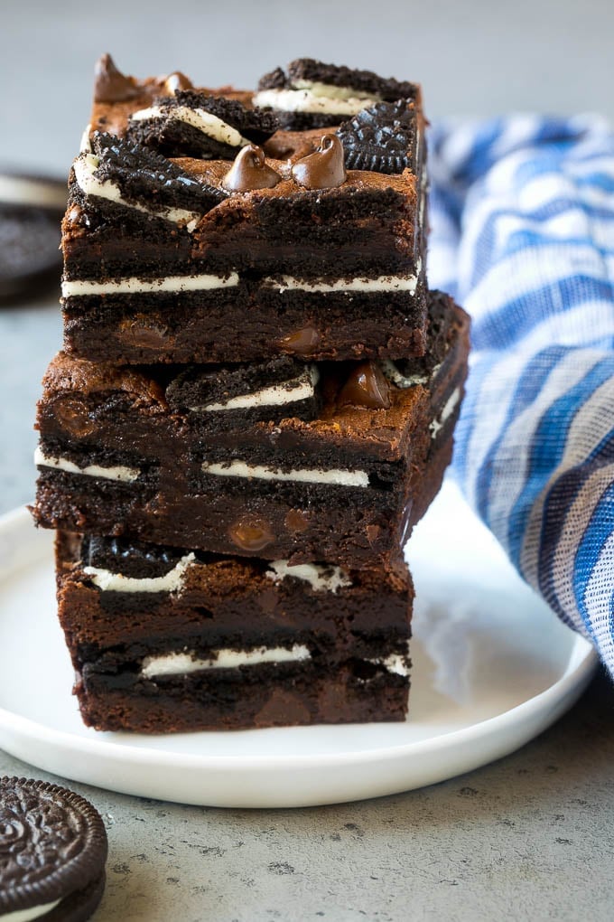 Oreo Brownies Recipe | Homemade Brownies | Chocolate Chip Brownies #brownies #oreos #chocolate #dessert #sweets #sadud A stack of Oreo brownies filled with sandwich cookies and chocolate chips.