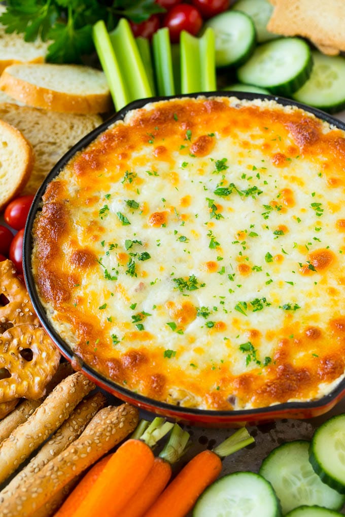 Reuben Dip Recipe | Corned Beef Dip | Cheese Dip #dip #cheese #cornedbeef #appetizer #lowcarb #keto #sadud Baked Reuben dip in a skillet served with crackers and vegetables.