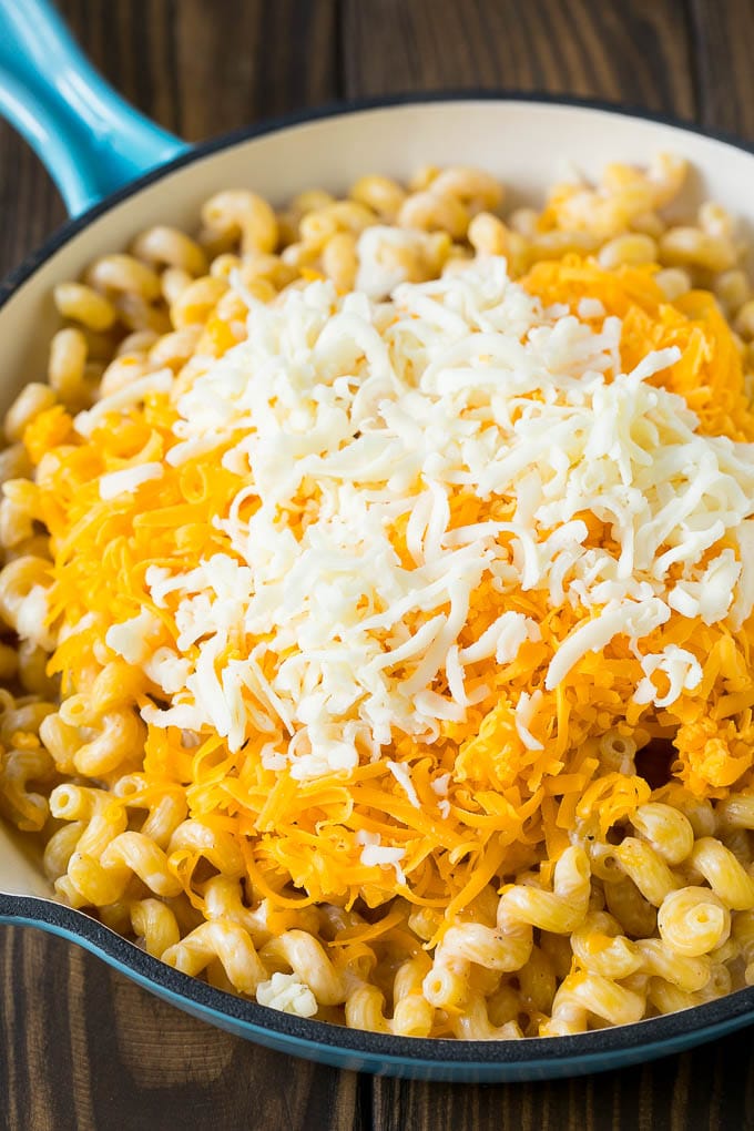 This baked mac and cheese is a blend of tender noodles in a rich and creamy cheese sauce. Noodles topped with two types of shredded cheese.