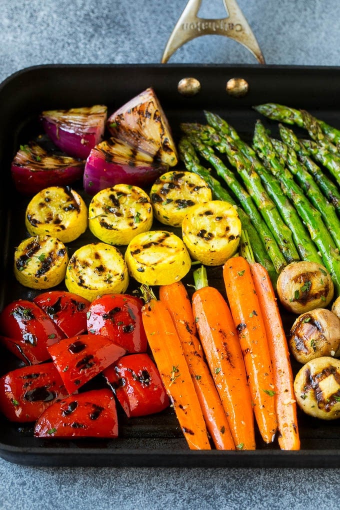 Grilled Vegetables Recipe | Marinated Vegetables | Grilled Veggies #vegetables #veggies #grilling #glutenfree #lowcarb #keto #dinner #sadud #cleaneating #healthy A grill pan with an assortment of vegetables cooking on it.