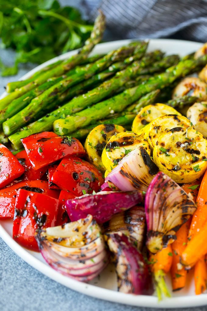 Grilled Vegetables Recipe | Marinated Vegetables | Grilled Veggies #vegetables #veggies #grilling #glutenfree #lowcarb #keto #dinner #sadud #cleaneating #healthy A platter of grilled veggies including peppers, onions and carrots.