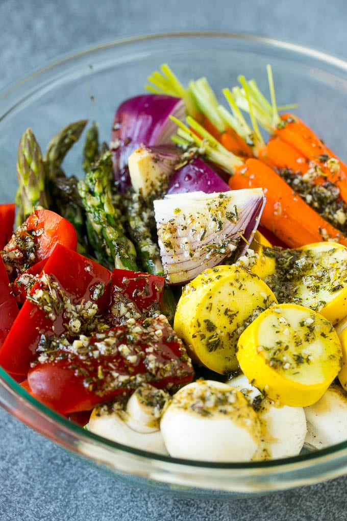 Grilled Vegetables Recipe | Marinated Vegetables | Grilled Veggies #vegetables #veggies #grilling #glutenfree #lowcarb #keto #dinner #sadud #cleaneating #healthy Raw veggies in a bowl with garlic, herbs and olive oil.