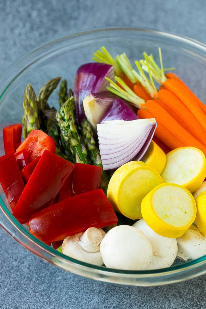 Grilled Vegetables Recipe | Marinated Vegetables | Grilled Veggies #vegetables #veggies #grilling #glutenfree #lowcarb #keto #dinner #sadud #cleaneating #healthy Carrots, peppers, squash, mushrooms and asparagus in a mixing bowl.