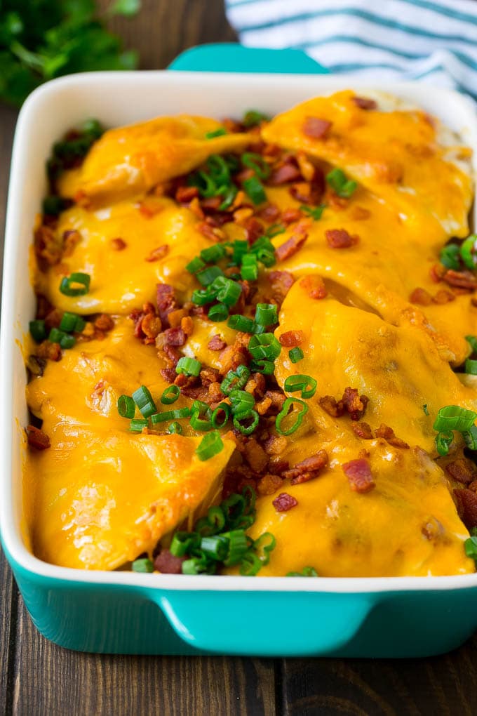 Pierogi Casserole Recipe | Potato Casserole #pierogis #casserole #bacon #cheddar #dinner #sadud A baked pierogi casserole topped with melted cheese, bacon and green onions.