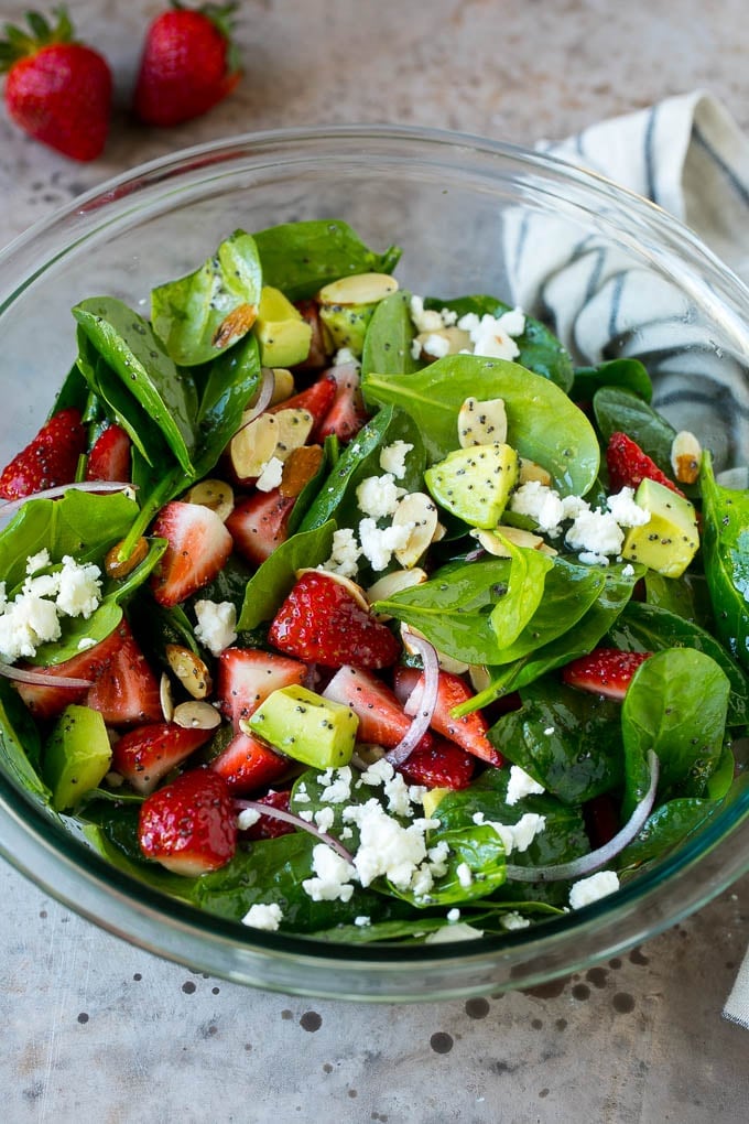 Strawberry Spinach Salad Recipe | Strawberry Salad | Spinach Salad #spinach #salad #strawberries #avocado #sadud A bowl of strawberry spinach salad with feta cheese, almonds and avocado.