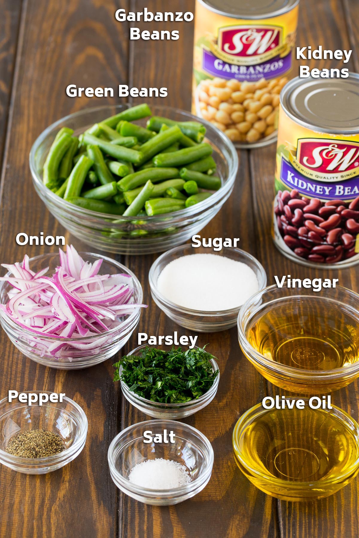 Ingredients for the recipe including veggies, olive oil, vinegar and seasonings.