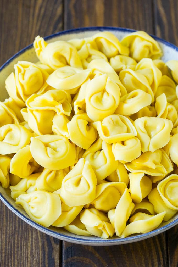 Greek Tortellini Salad Recipe | Pasta Salad | Tortellini Salad | Greek Salad #greek #tortellini #pasta #salad #cucumbers #olives #dinner #sadud A bowl of cooked cheese tortellini.