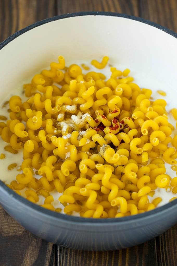 Lobster Mac and Cheese Recipe | Lobster Macaroni and Cheese | Baked Mac and Cheese #pasta #macandcheese #macaroni #lobster #cheese #dinner #sadud Pasta with milk and spices in a pot.