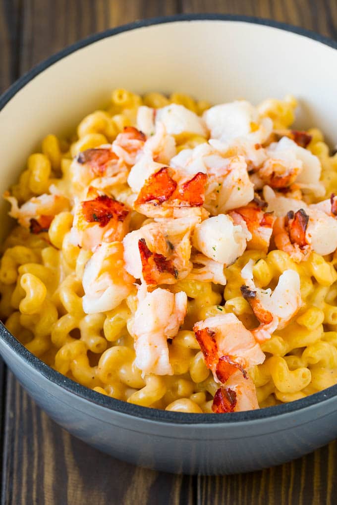 Lobster Mac and Cheese Recipe | Lobster Macaroni and Cheese | Baked Mac and Cheese #pasta #macandcheese #macaroni #lobster #cheese #dinner #sadud Stove top mac and cheese topped with pieces of cooked lobster.