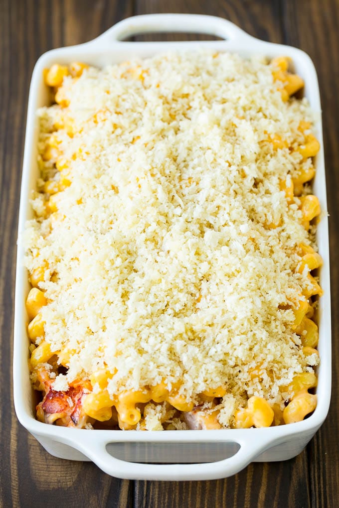 Lobster Mac and Cheese Recipe | Lobster Macaroni and Cheese | Baked Mac and Cheese #pasta #macandcheese #macaroni #lobster #cheese #dinner #sadud A casserole dish of lobster mac and cheese topped with panko breadcrumbs.
