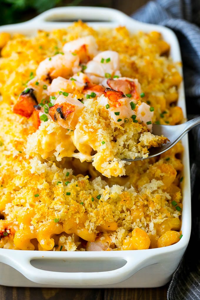 Lobster Mac and Cheese Recipe | Lobster Macaroni and Cheese | Baked Mac and Cheese #pasta #macandcheese #macaroni #lobster #cheese #dinner #sadud A spoon serving up a portion of lobster mac and cheese.