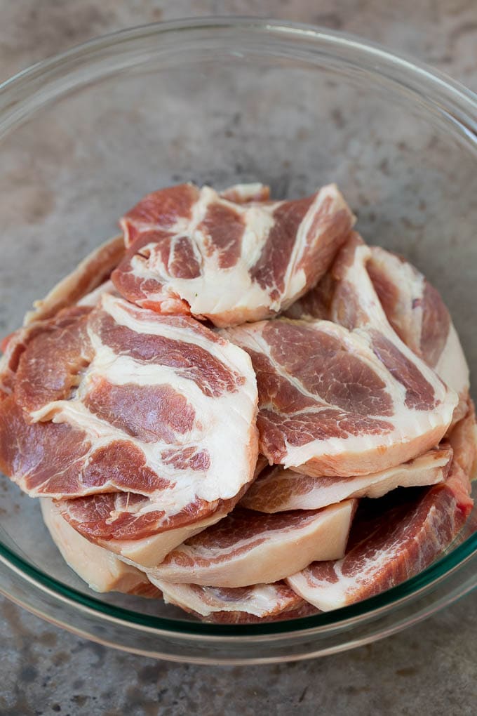 Tacos al Pastor Recipe | Pork Tacos | Mexican Tacos #tacos #pork #pineapple #grilling #tacotuesday #dinner #sadud Sliced pork shoulder in a bowl.