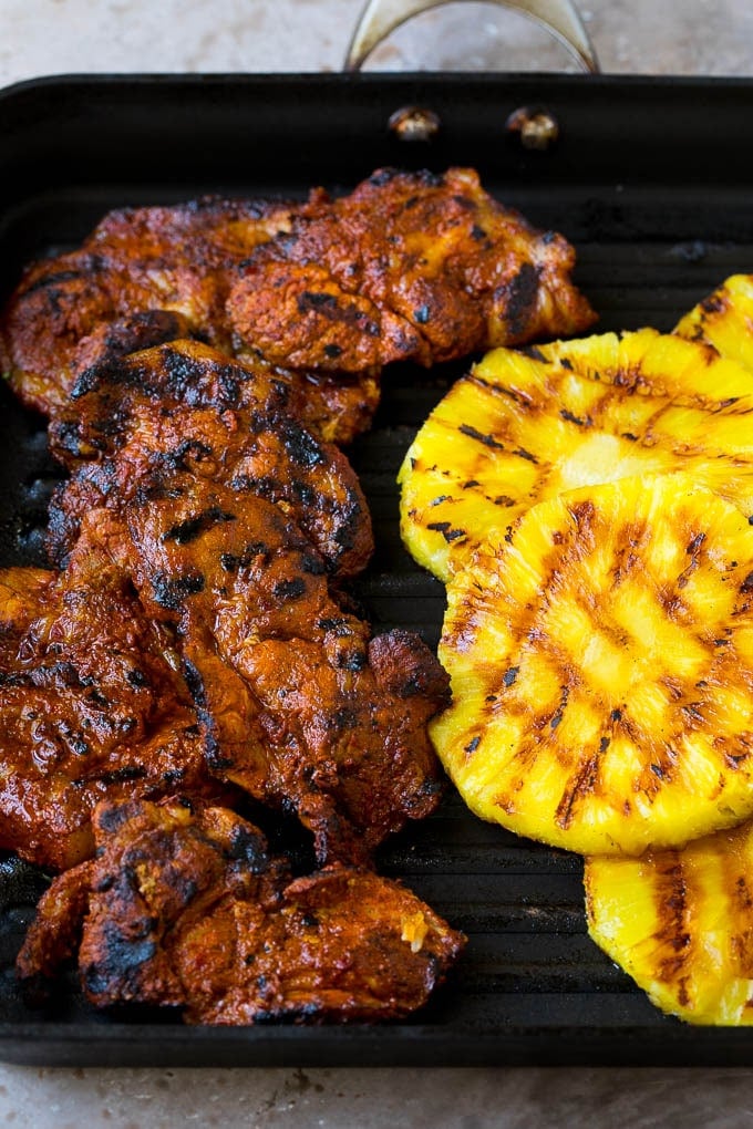 Tacos al Pastor Recipe | Pork Tacos | Mexican Tacos #tacos #pork #pineapple #grilling #tacotuesday #dinner #sadud Grilled pork and pineapple on a pan.