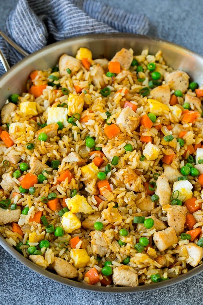 Chicken Fried Rice Recipe | Chinese Fried Rice #rice #chicken #peas #carrots #sidedish #dinner #sadud A pan of chicken fried rice with eggs and vegetables.