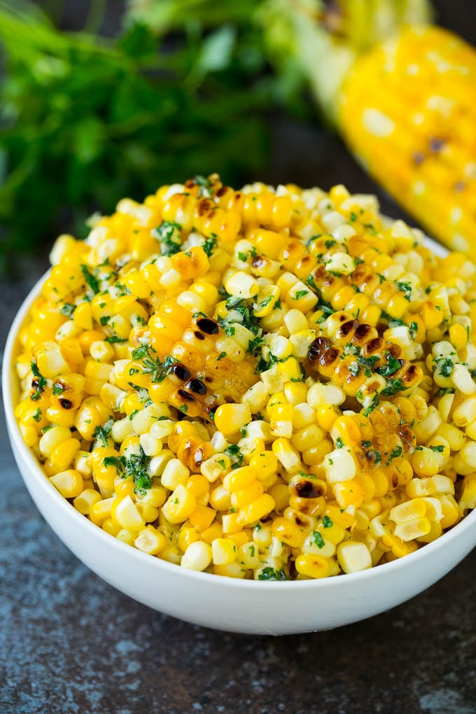 Grilled Corn on the Cob Recipe | Corn Recipe #corn #grilling #summer #sidedish #dinner #sadud Grilled corn cut off the cob with herb butter in a bowl.
