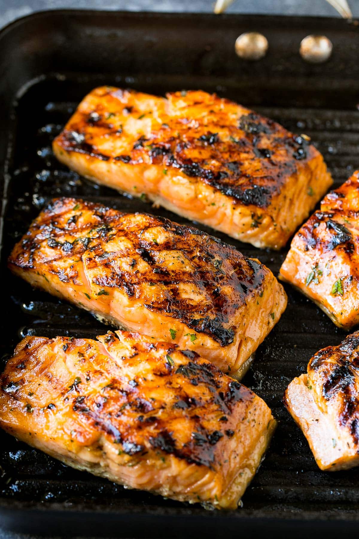 Cooked fish filets on a pan.