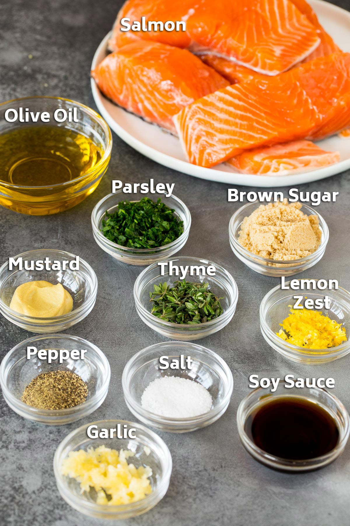 Ingredients including fillets, olive oil, soy sauce, herbs and spices.