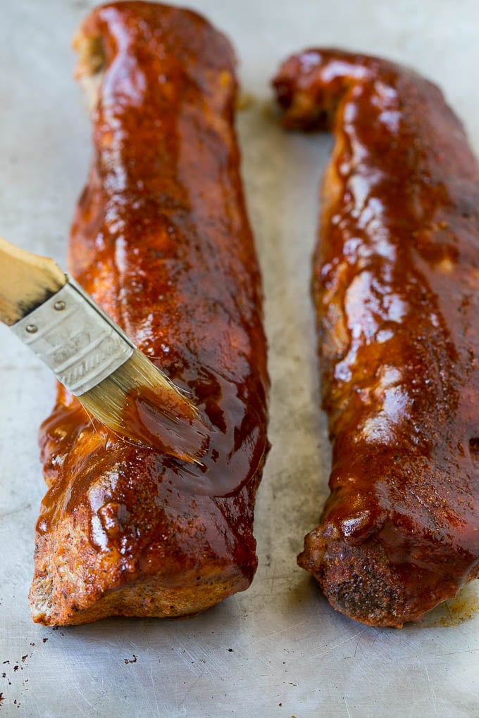 Smoked Pork Tenderloin Recipe | Smoked Pork Loin | BBQ Pork #pork #tenderloin #smoker #dinner #sadud BBQ sauce being brushed over smoked pork loin.
