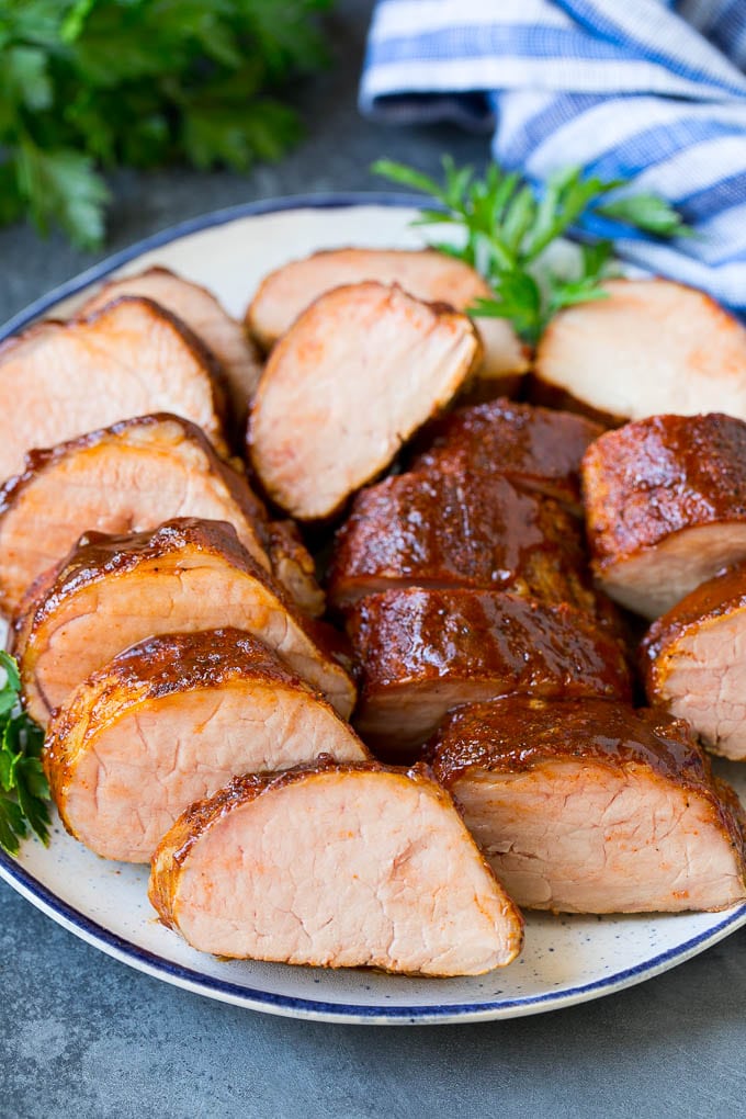 Smoked Pork Tenderloin Recipe | Smoked Pork Loin | BBQ Pork #pork #tenderloin #smoker #dinner #sadud Smoked pork tenderloin sliced on a serving plate.